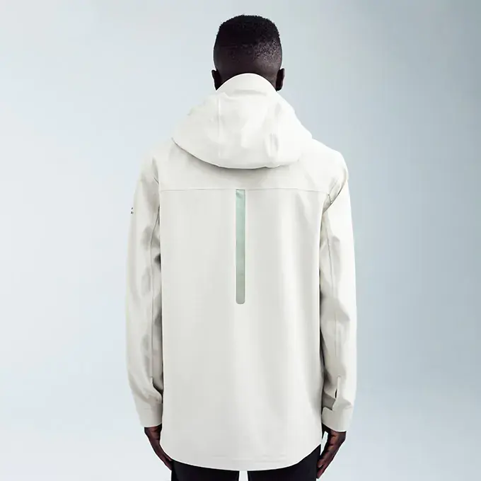 Back of the off-white Ulterior Waterproof Hardshell Jacket with an iridescent kiss-cut application